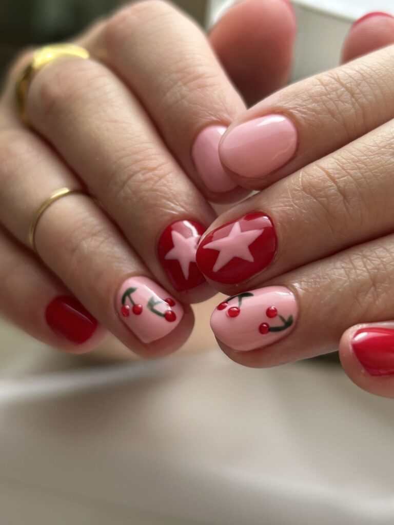 cute short spring nail designs with cherries, red polish, and pink accents
