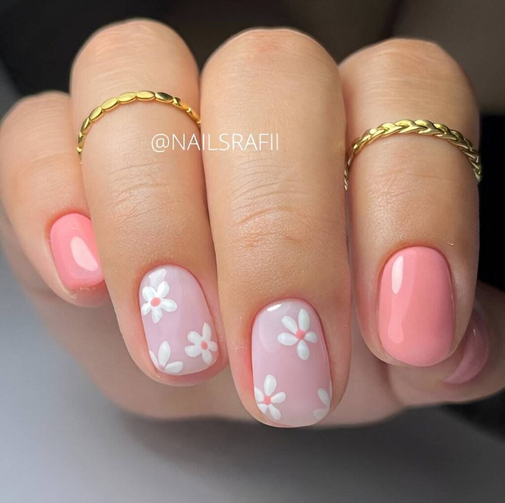 short pink nails in pink with tiny daisies