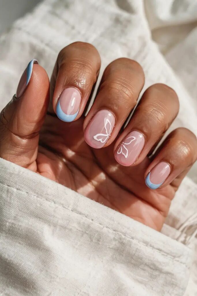 simple spring nail designs for short nails with a french tip and butterfly design